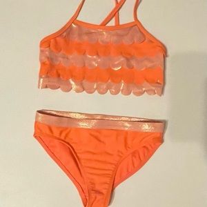 This is bright orange swimsuit. It has only been worn 1 time, in great condition